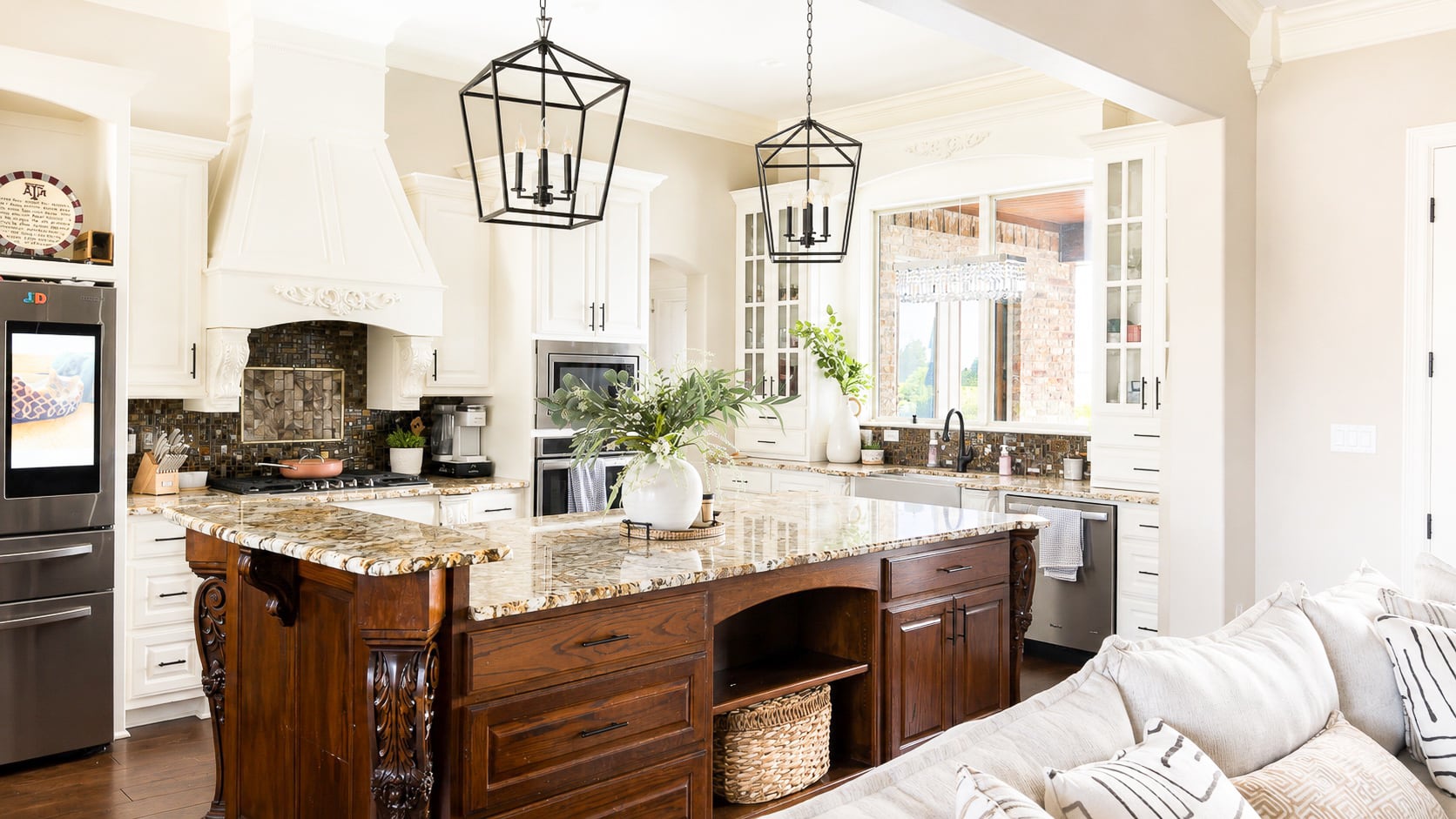 Open kitchen with custom cabinetry and large island